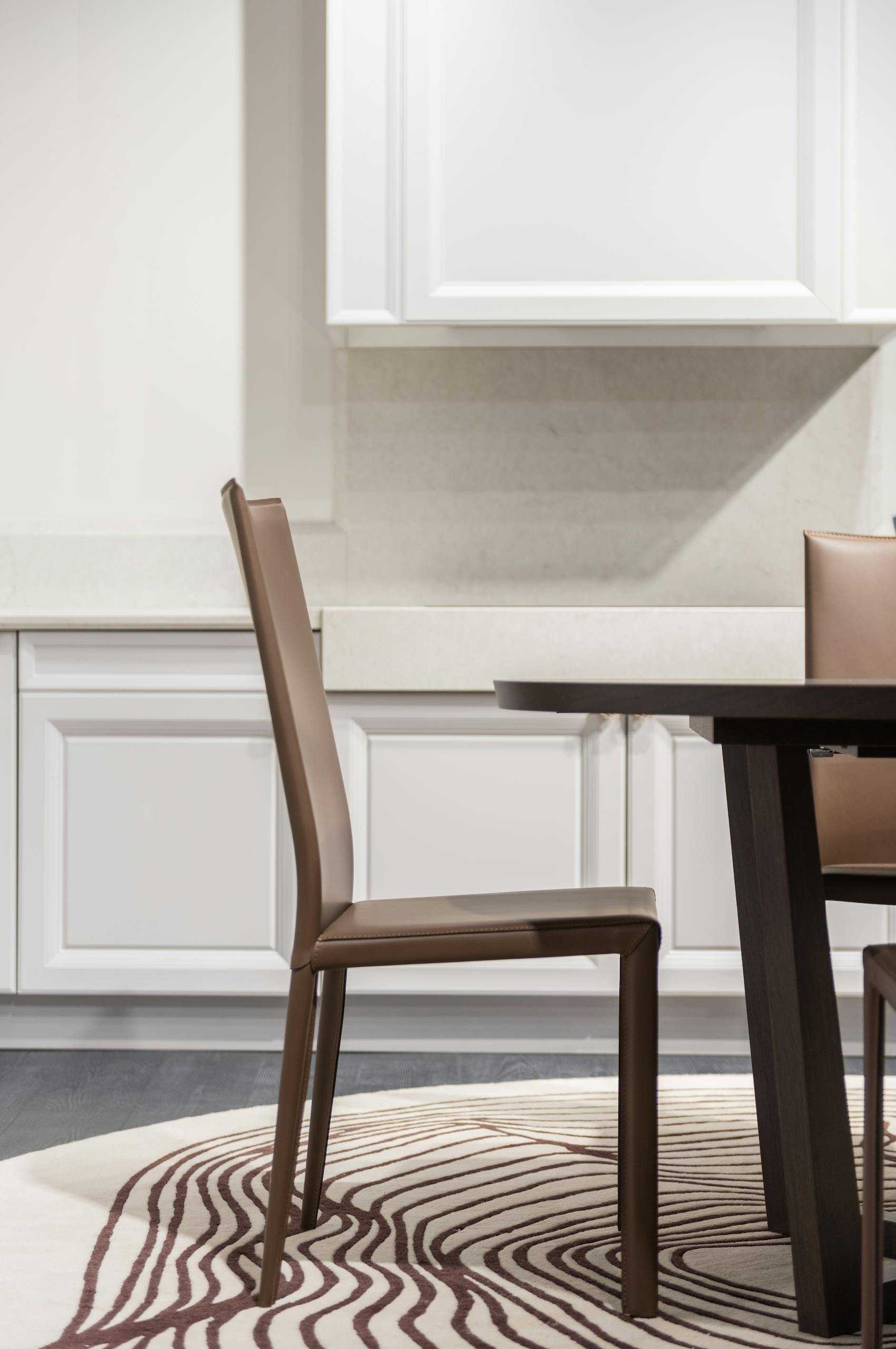 Elegant dining room showcasing modern furniture and chic design elements.